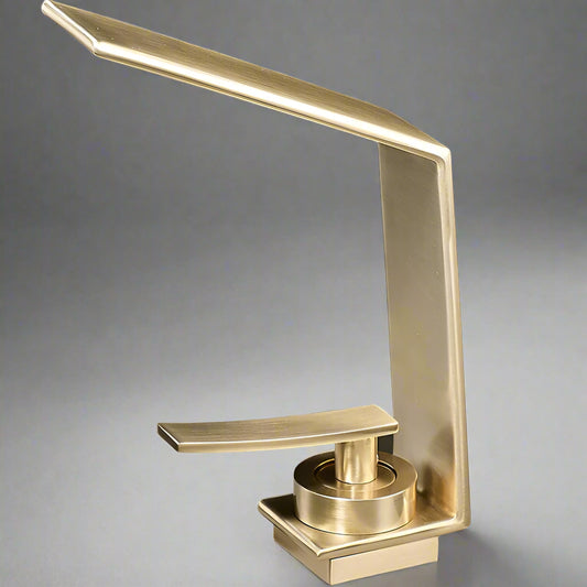 The Valmont Single Handle Bathroom Faucet by Morsale.com features a modern brushed gold finish, sleek angular design, and flat lever handle, crafted from solid brass and showcased against a plain gray background.