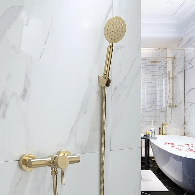 The AllFixture Wall Mounted Shower Faucet With Handheld is installed on a white marble wall, with a modern bathtub and glass shower in the background.