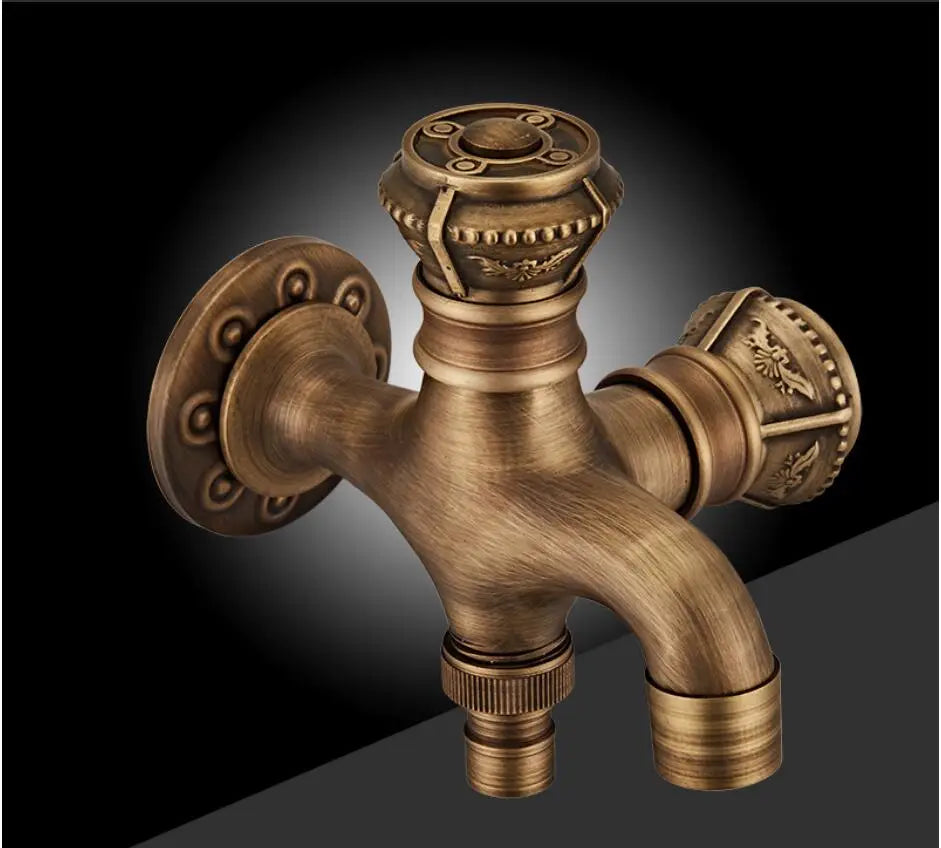 Introducing the "Antique Brass Bidet Faucet Wall Mounted Carved Bidet Faucet" by Allfixture: This vintage-style, ornate fixture is made of high-quality brass and features a beautifully detailed double faucet design. The wall-mounted installation includes intricately patterned knobs and a single central spout, all showcased against a dark, gradient background.