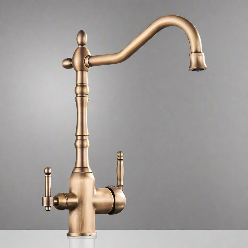 The Uythner Antique Brass Kitchen Faucet With Filtered Water Tap features a vintage design, two handles, and a high curved spout, displayed against a plain gray background.