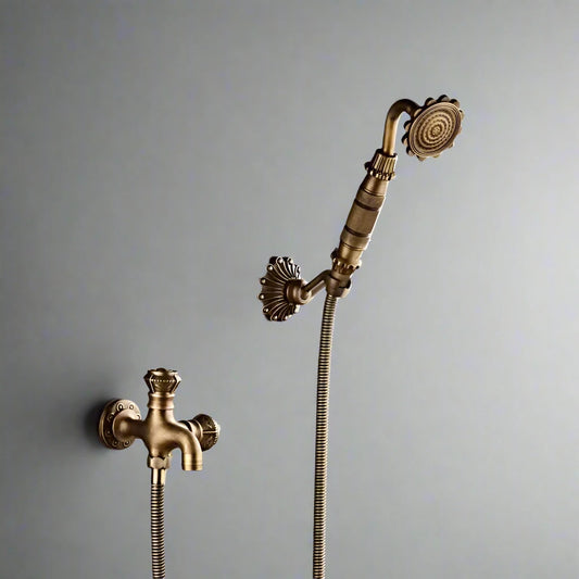 The Allfixture Heritage Wall-Mounted Bidet Faucet set features a vintage-style bronze handheld showerhead with ornate detailing, shown against a plain gray background.