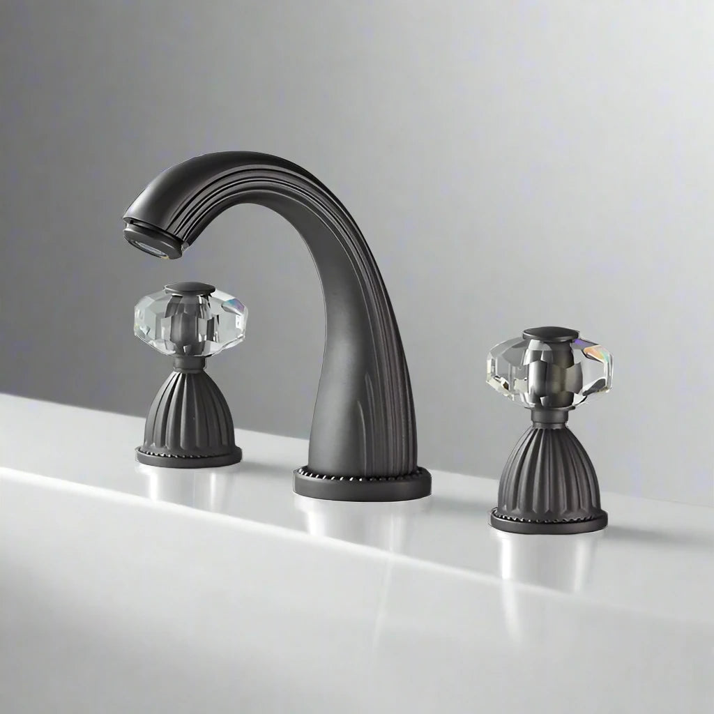 The Allfixture Heritage Widespread Basin Faucet features a curved matte black spout and two crystal-style handles, installed on a white countertop for a stylish 3-hole design.