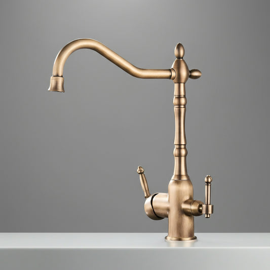 The Uythner Maison Kitchen Faucet with Filtered Water Tap features dual handles, a tall curved spout, and a brushed gold finish, elegantly mounted on a white countertop against a plain gray background.