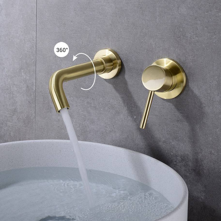 A modern Wall Mounted Solid Brass Bathroom Faucet from Morsale.com is shown pouring water into a white sink. The bathroom faucet features a sleek, curved spout and a single handle for temperature control. The background is a light gray wall with a small plant partially visible.