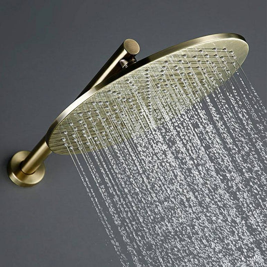 A modern shower setup features the *Wasser™ Brushed Gold Shower Faucet With Handheld Shower* from *Morsale.com*, dispensing water over a grey matte wall. It includes a handheld shower attachment and a sleek, round metal control knob reminiscent of a refined bathroom sink faucet. The background shows a partially open sliding door revealing a bright room.