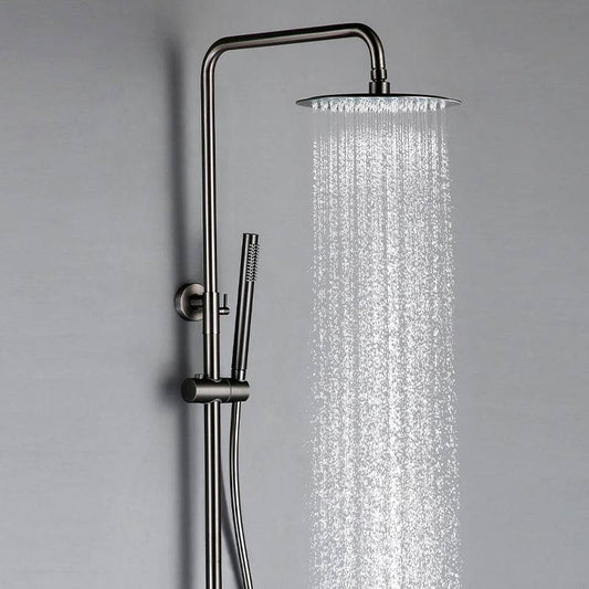The Wasser™ Gunmetal Grey Shower Faucet With Handheld Spray by Morsale.com is a sleek, modern shower system featuring a round overhead showerhead and a detachable handheld spray wand. The showerhead releases a stream of water, set against a light gray background. With its brushed metal finish, this fixture offers a minimalist aesthetic reminiscent of high-end bathroom faucets.