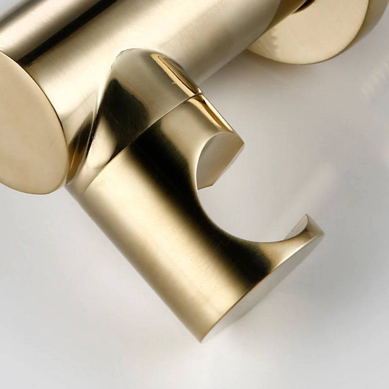 A modern bathroom wall showcases the Tiqui Wasser™ Solid Brass Bathtub Faucet With Handheld Shower. It includes a round control valve with a lever handle, a curved faucet spout, and a handheld shower head connected by a flexible hose. The light grey wall complements the sleek design, and the tub edge is visible.