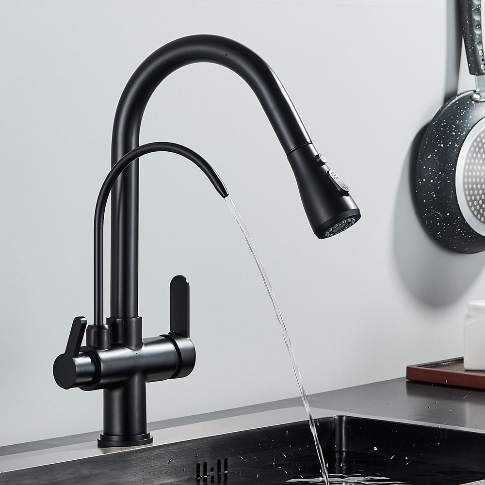 A person is turning on the Rozin Touch Sensor Brass Kitchen Faucet With Filtered Water Tap, which features a sleek, modern black design and a curved spout. Water flows smoothly into the sink below while kitchen items like a pan, soap dispenser, and bottles are visible on the counter in the background. This versatile faucet could easily complement any bathroom sink or shower setup.