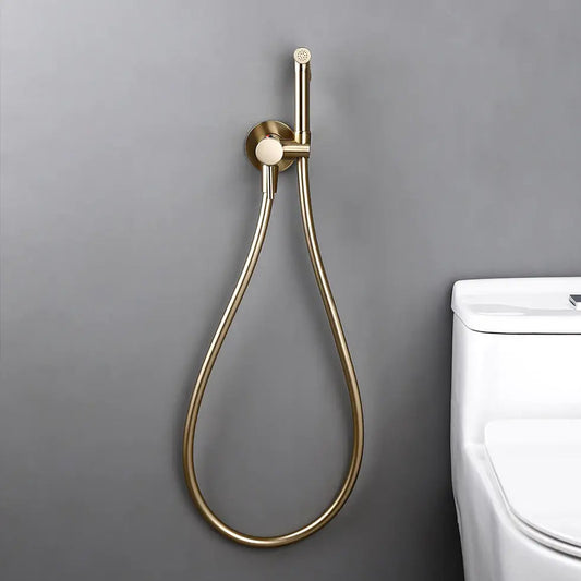 The allfixture Wall-Mounted Solid Brass Bidet Faucet, finished in modern gold and complete with a flexible hose and wall mount, brings both elegance and practicality to any contemporary bathroom next to your white toilet.
