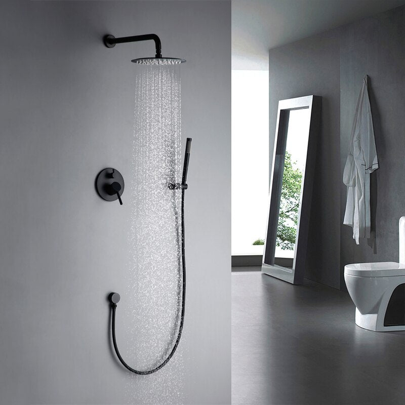 Modern bathroom with a black Wasser™ Solid Brass Shower Faucet With Handheld Shower by Morsale.com and a control panel on a white wall. The adjacent wall features three irregularly shaped mirrors above a sleek black vanity with two sinks and matching bathroom faucets. The design is minimalistic and contemporary.