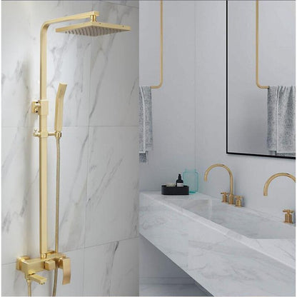 A modern bathroom featuring the Wasser™ Brushed Gold Shower System from Morsale.com, which includes a square overhead rain showerhead and a matching handheld showerhead. A detailed inset highlights the sleek gold faucet and lever controls of the stylish bathroom sink faucet. The background shows marble-style wall tiles and a hanging towel.