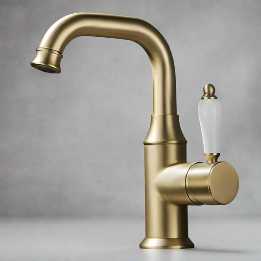The Tiqui™ Single Handle Bathroom Sink Faucet by Tiqui features a brushed gold finish, a curved spout, and a stylish white and gold lever handle, set against a gray background to highlight its elegant design.