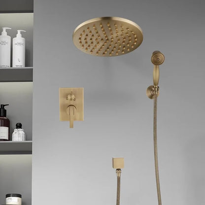 Mounted on a light gray wall, the Antique Brass Shower System with Handheld Shower from Morsale.com showcases a large overhead rain shower head, a flexible handheld showerhead, a control lever, and a secondary knob. Its minimalist design exudes modern elegance similar to high-end kitchen sink faucets.