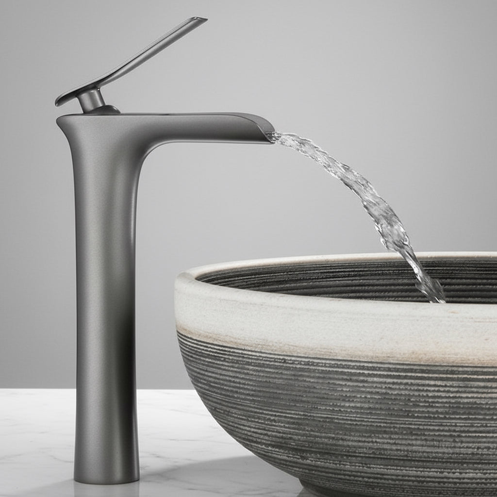 Valmont single handle bathroom sink faucet with modern design pouring water into a contemporary bowl sink.