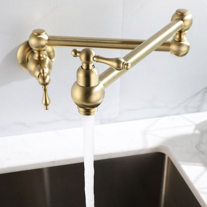 A Tiqui Kitchen Pot Filler Faucet with an adjustable arm is mounted on a white marble wall. The faucet is turned on, and water is flowing into a sink below. In the background, there's a fruit bowl containing green apples, adding a touch of freshness to the scene typical for elegant kitchen faucets or shower heads.