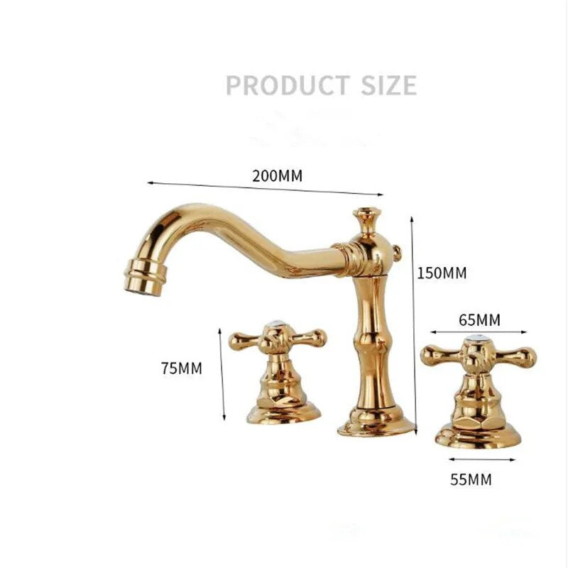 A polished gold Dual Handle Solid Brass Deck Mounted Bathroom Faucet from Tiqui set on a white countertop. The set features a curved spout with elegant detailing and two cross-handle knobs for hot and cold water control. The background is white with gray veining, resembling marble—truly an exquisite choice among bathroom faucets.