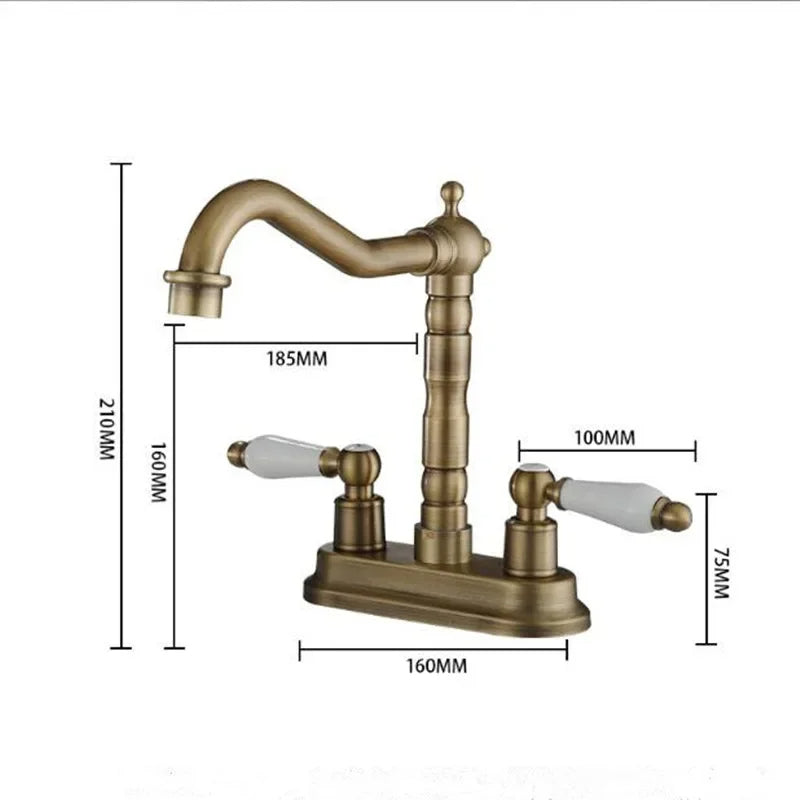 The "Antique Brass Bathroom Faucet - Timeless Elegance for Your Sink" by Allfixture stands over the sink, water flowing gracefully from its dual handle design with white handles. The background features a dark, marble-like surface. A soap dispenser is visible in the left corner of the image, complementing the premium brass construction.