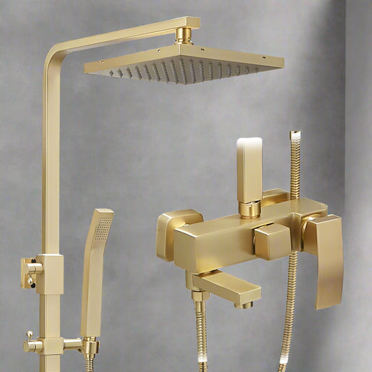 The Wasser™ Brushed Gold Shower System by Morsale.com features a square overhead and solid brass handheld showerhead with a wall-mounted mixer tap, all set against a grey tiled background.