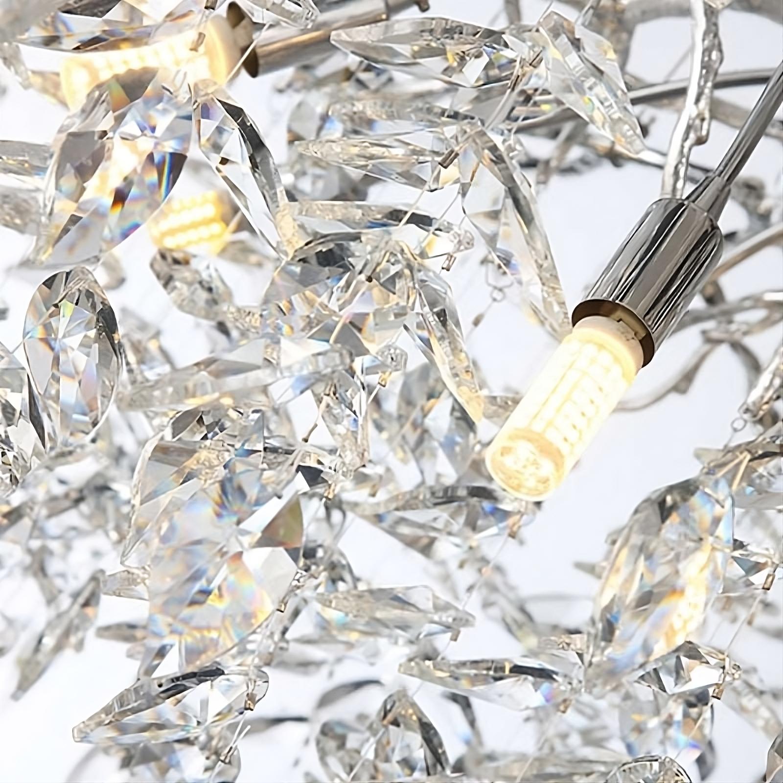 Close-up of the intricate Albero Collection Crystal Ceiling Light Fixture by Morsale.com, featuring multiple faceted crystal pieces and a few visible dimmable LED bulbs. The crystals reflect light, creating a sparkling effect against a white background.