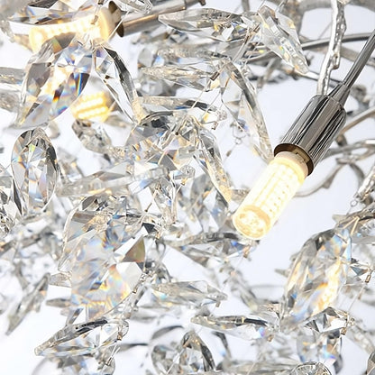Close-up of the intricate Albero Collection Crystal Ceiling Light Fixture by Morsale.com, featuring multiple faceted crystal pieces and a few visible dimmable LED bulbs. The crystals reflect light, creating a sparkling effect against a white background.