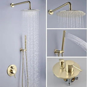 A modern bathroom features the Wasser™ Brushed Gold Shower Set With Handheld Shower from Morsale.com, elegantly mounted on a gray wall. Nearby, a white towel hangs on a hook, and a white toilet sits against the back wall. The floor is adorned with a gray rug, and close to the bathroom sink faucet, a small stack of books rests beside the toilet.