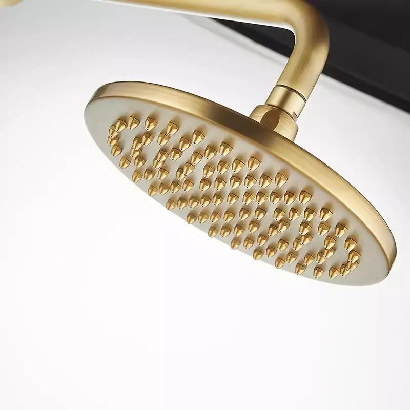 A close-up view of the round, antique brass showerhead from Allfixture's Bathroom Shower Faucet with Handheld Shower Head collection, featuring multiple water nozzles. The contemporary showerhead is mounted on a matching antique brass arm, set against a neutral background.