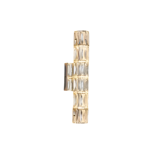 The Bacci Crystal Wall Light Sconce from Morsale.com features a contemporary design with clear glass panels in a geometric pattern, accented by a gold finish, and mounted on a white background.
