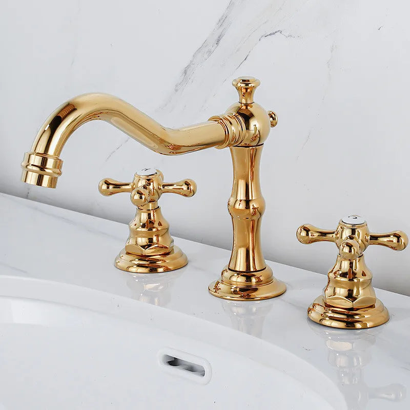 The AllFixture Maison Brass Widespread Bathroom Faucet features two cross-handle knobs and a curved spout in a gold finish, installed on a white sink with a marble-patterned wall background.