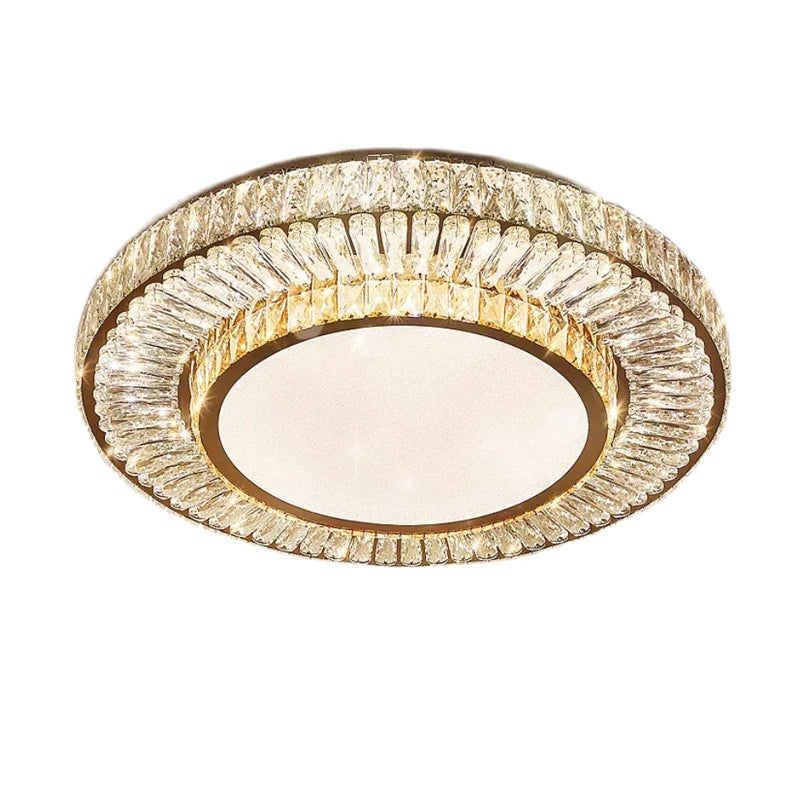 The Morsale Gio Crystal Ceiling Chandelier is a circular ceiling light with a golden frame and textured glass design. It features a dimmable frosted glass center, surrounded by intricate amber crystal-like details for an elegant and luxurious look.