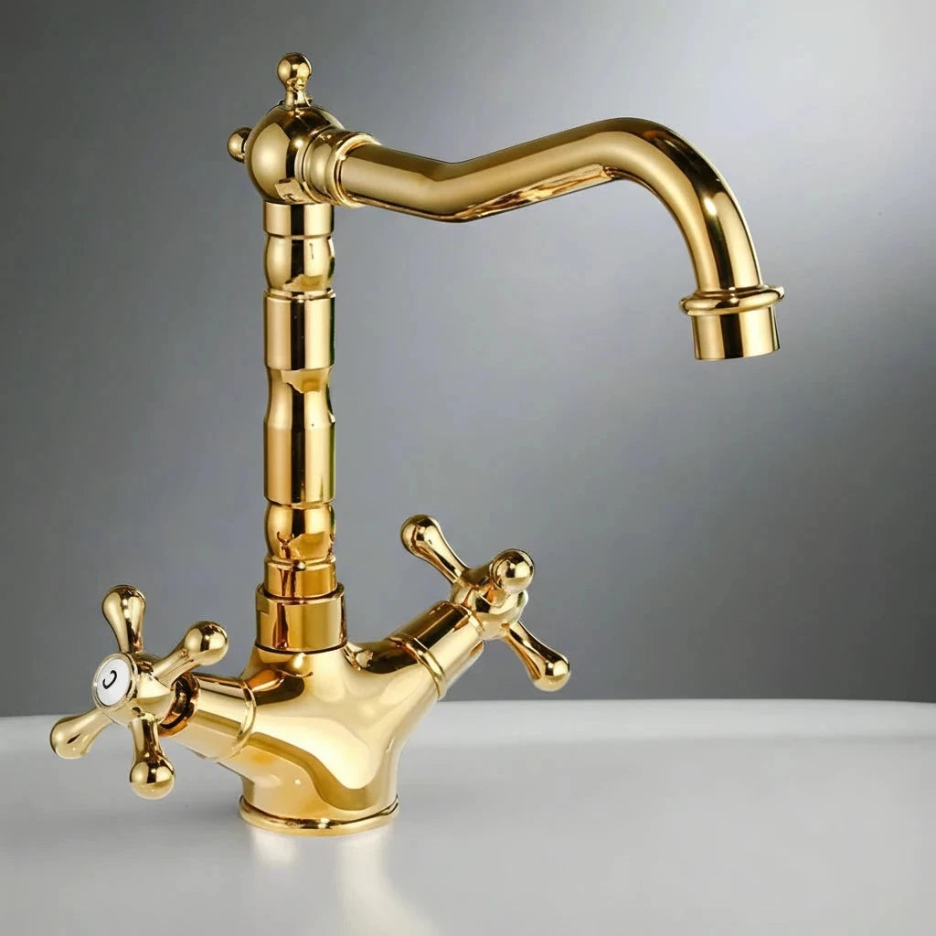 The AllFixture Heritage Two Handle Bathroom Sink Faucet, featuring cross handles and a curved spout in shiny gold, stands on a white surface against a gray background.