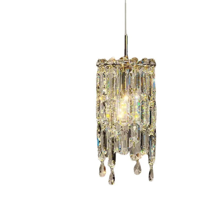 The Morsale Gio Crystal Pendant Light embodies modern elegance with its cylindrical design and multi-faceted glass pieces, creating a sparkling effect. Light reflects through the crystal shade, producing a shimmering look as it is gracefully suspended by a thin wire.