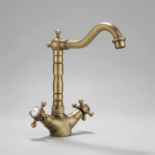 The Allfixture Heritage Two Handle Bathroom Sink Faucet, made of solid brass, features a curved spout and cross handles (one marked "cold"), with a matte finish and classic style, set against a plain gray background.