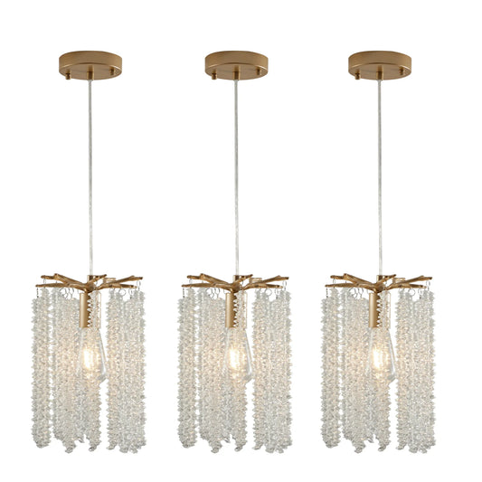 The Morsale Albero Crystal Pendant Lights, Set of 3, features elegant fixtures with gold accents and cascading elements. Each light has a single bulb encased in crystal adornments, offering a luxurious touch and modern design for any space.