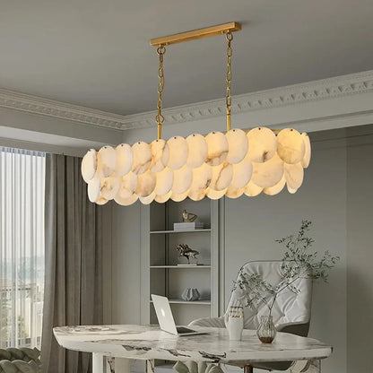 Elegant Moonshade Marble Dining Room Chandelier crafted with natural Spanish marble and brass construction, emitting warm light for cozy gatherings.