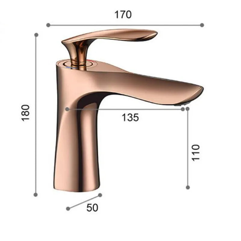 A close-up view of the Allfixture Rose Gold Bathroom Faucet – Deck Mounted Basin Sink Mixer showcases water gracefully flowing into a pristine white sink. The background features a gray textured wall. This faucet boasts a contemporary design with smooth curves and a polished finish, epitomizing modern bathroom designs.