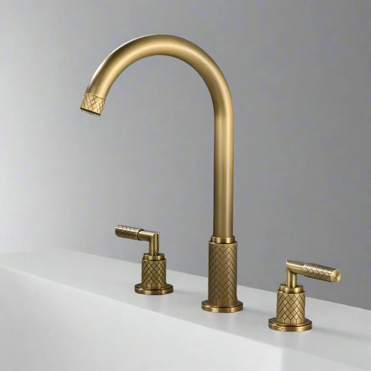 The Mike Jake Antique Brass Single‑Handle Bathroom Faucet features a tall curved spout and textured design, mounted on a white countertop against a gray background.