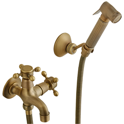 The Allfixture Antique Brass Wall Mounted Bidet Faucet Hand shower features a retro-style design with double handles, a handheld showerhead with flexible hose, intricate detailing, and a wall mount holder, adding elegance to any bathroom space.