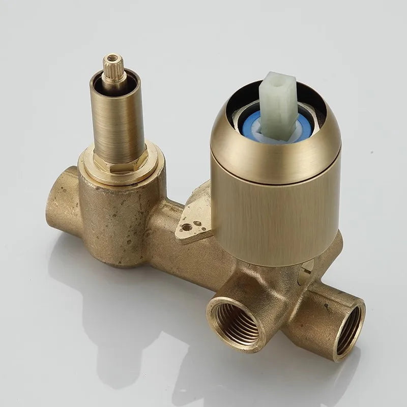 The AllFixture Heritage Antique Brass Shower System with Handheld Shower features a brass valve with threaded pipe connections and two cylindrical fittings, including a white plastic insert, shown on a plain white background.