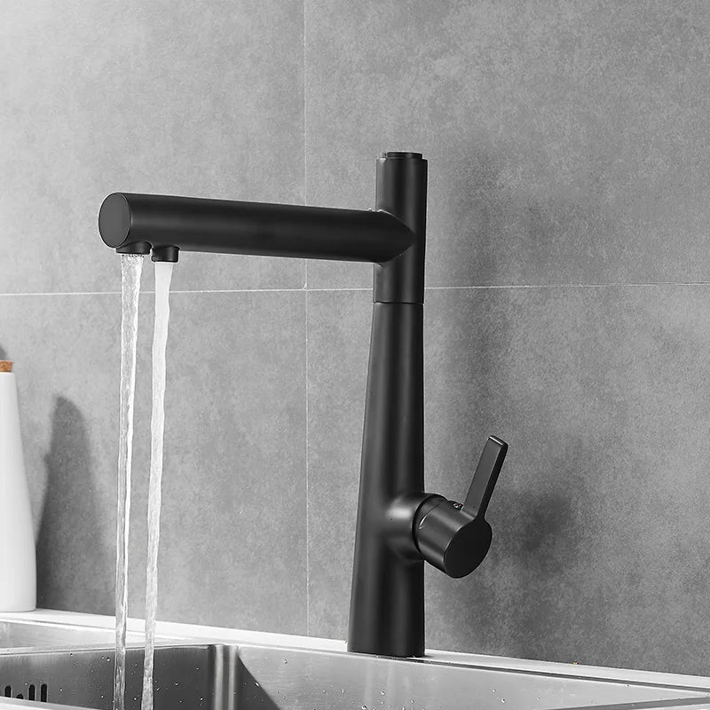 In this chic modern kitchen, an Allfixture Kitchen Faucet With Purified Water Tap, featuring a sleek design and a matte black finish, is mounted over a stainless steel sink against a gray tiled backsplash. Purified water flows smoothly from the faucet, and a white bottle is partially visible on the left.