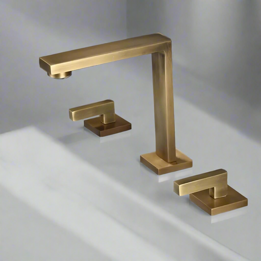 A close-up of the Tiqui Brushed Gold Waterfall Widespread Bathroom Faucet, showcasing its elegant design and ceramic valve core for smooth operation.