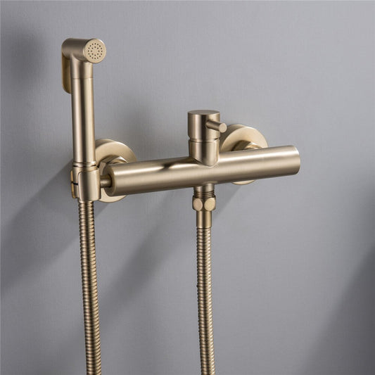 The Wasser™ Wall Mounted Toilet Sprayer Bidet Faucet by allfixture showcases a sleek, brass design. It includes a handheld sprayer on the left connected by a flexible hose, a central control knob, and an additional outlet on the right side, embodying the elegance of premium bathroom fixtures. The backdrop is light grey.