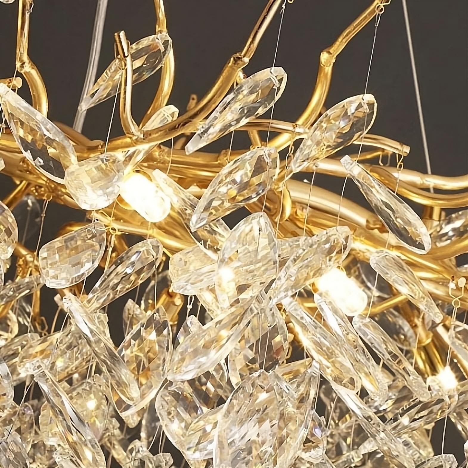 The Albero Collection Crystal Ceiling Light Fixture by Morsale.com features an ornate, gold-toned chandelier design adorned with numerous hanging crystal prisms. Its intricate structure includes branching gold elements, enhanced by dimmable LED bulbs for added versatility. This gives the chandelier an elegant and luxurious appearance as the crystals catch and reflect the light beautifully.