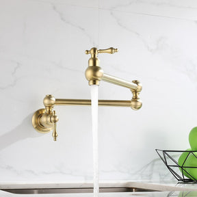 A Tiqui Kitchen Pot Filler Faucet with an adjustable arm is mounted on a white marble wall. The faucet is turned on, and water is flowing into a sink below. In the background, there's a fruit bowl containing green apples, adding a touch of freshness to the scene typical for elegant kitchen faucets or shower heads.