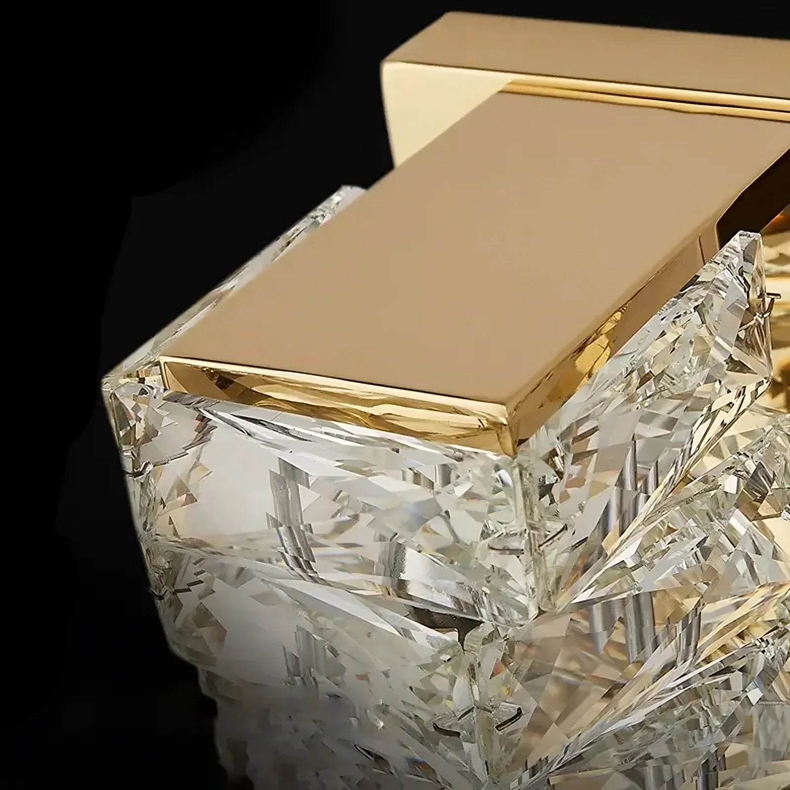 A detailed shot of a premium perfume bottle, capped with a sleek rectangular golden top that embodies contemporary style. The bottle showcases exquisite, multifaceted crystal craftsmanship, exuding luxury and elegance. The sophisticated black background mirrors the refinement found in Morsale.com's Bacci Crystal Wall Sconces.