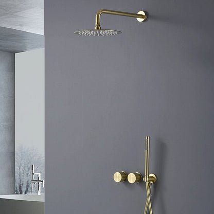 A minimalist bathroom features a matte gray wall with the modern Aodei Wasser™ Complete Shower System in brushed gold. The wall-mounted rain showerhead, sleek hand shower, and dual control knobs complement the simple yet elegant design. A partial view of a washbasin with a matching bathroom sink faucet is seen in the background.