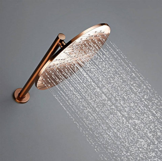 The Wasser™ Rose Gold Shower System With Handheld Shower by Morsale.com features a modern, round, rose gold showerhead mounted on a horizontal pipe. Much like high-end bathroom faucets, it sprays streams of water downward against a simple gray background. The clear water flow highlights the design and functionality of the showerhead beautifully.
