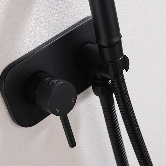 The Morsale.com Wall-Mounted Brass Bidet Sprayer – Handheld features a matte black finish, single lever marked "H" and "C", and dual flexible hoses—an elegant fixture that brings modern style to your bathroom.