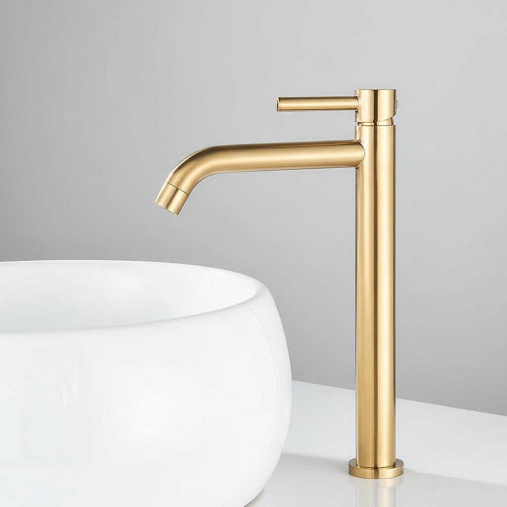 Windsor Deck Mounted Bathroom Sink Faucet, Brushed Gold next to a round white sink.