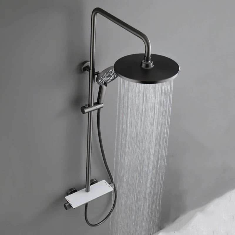 The Complete Shower System With Bathtub Faucet by Mike Jake is a modern, matte black wall-mounted setup that includes a round overhead shower head and an adjustable handheld shower wand, both designed for efficient water dispensing. The system is mounted on a gray wall with a sleek and minimalist design, seamlessly complementing the aesthetic of contemporary kitchen sink faucets.