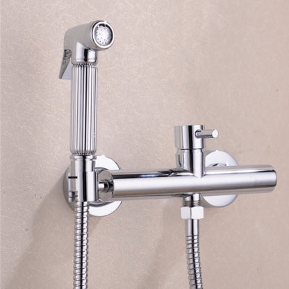 A hand holding the Wasser™ Solid Brass Handheld Toilet Sprayer by allfixture, attached to a matching wall-mounted fixture, much like elegant bathroom faucets. Water is spraying from the sprayer, and the scene is set against a light-colored backdrop.